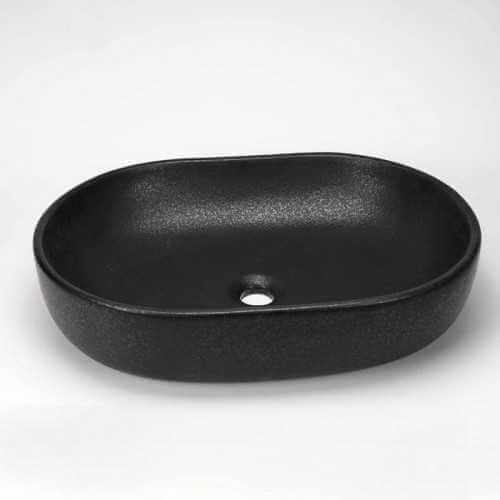 Oval black ceramic flooring pan on Rue du Bain